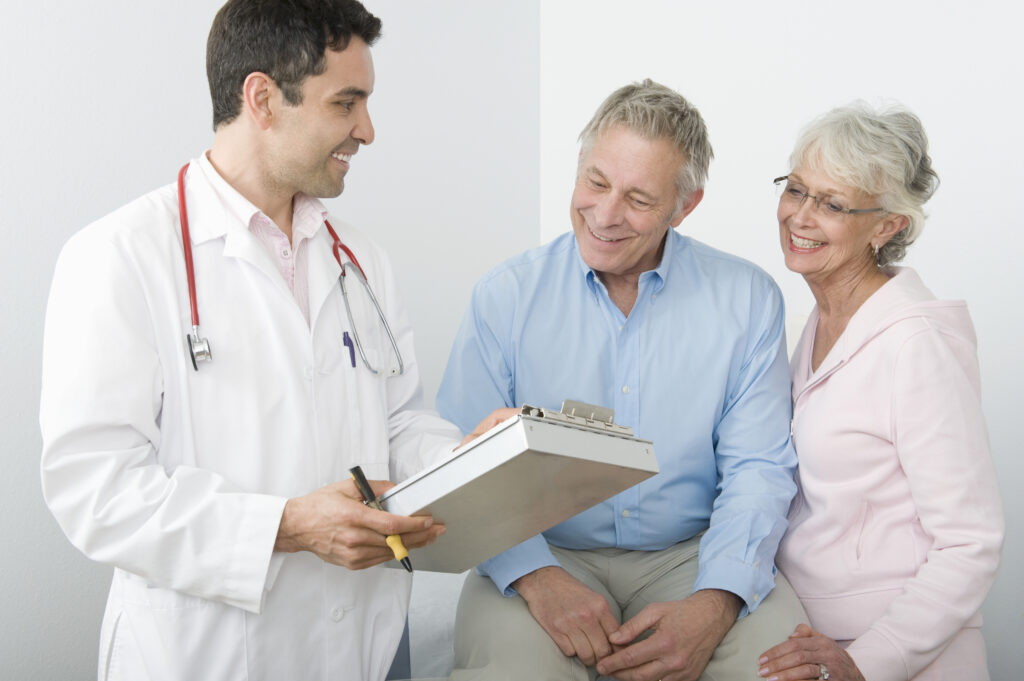 Doctor showing medical report to patient